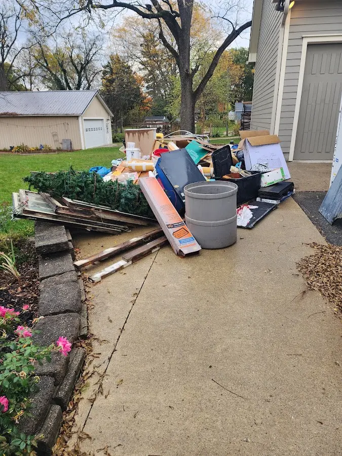 Dumpster being loaded with debris for 3 Yard Dumpster Rental in Royal Pines